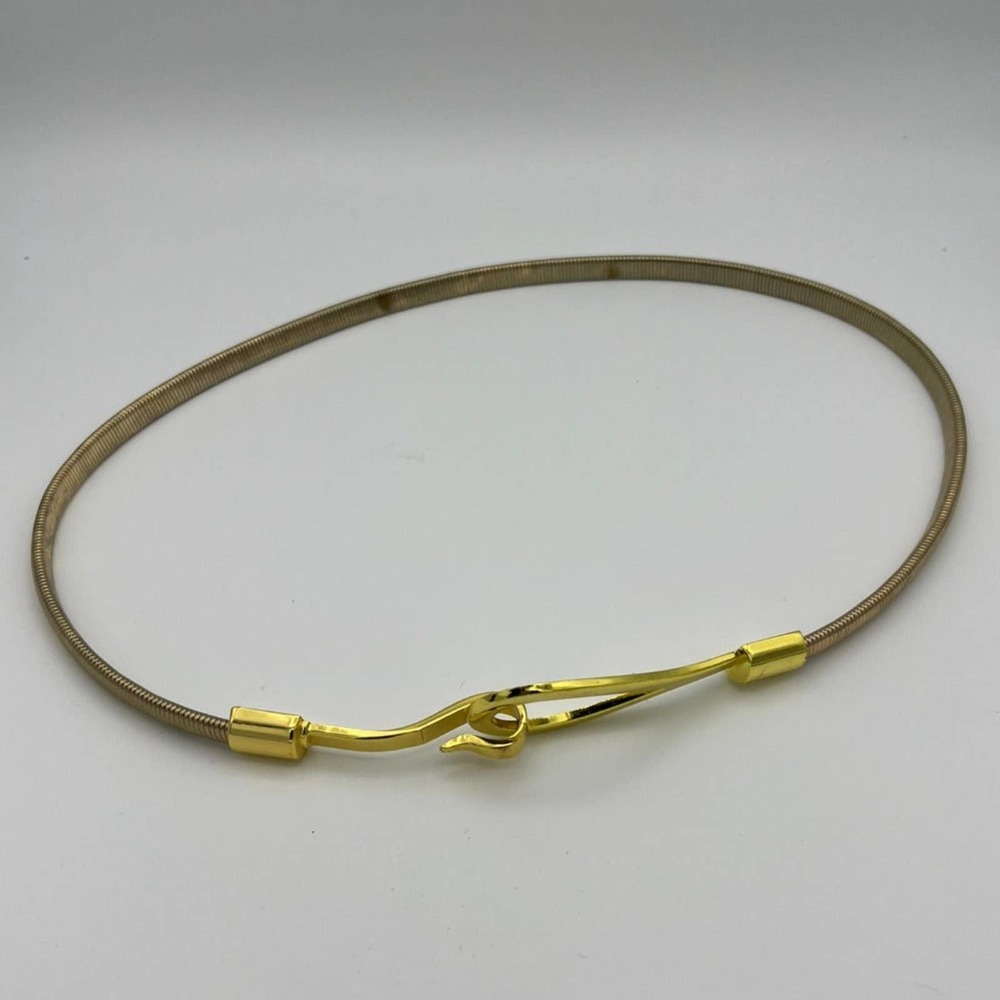 Expandable Silver and Gold Stretch Metal Belts with Hook and Loop Buckles.